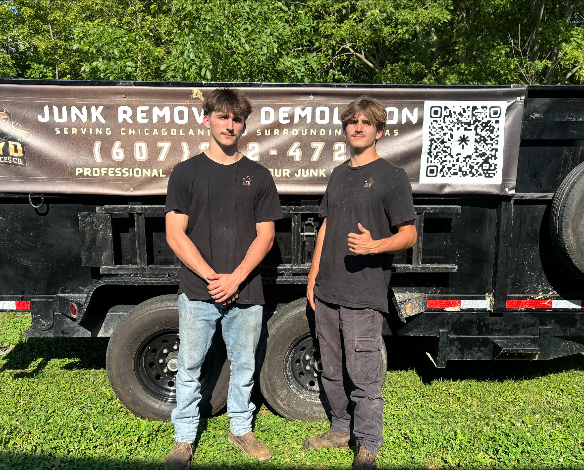 JYD Services Co. brothers in front of their truck