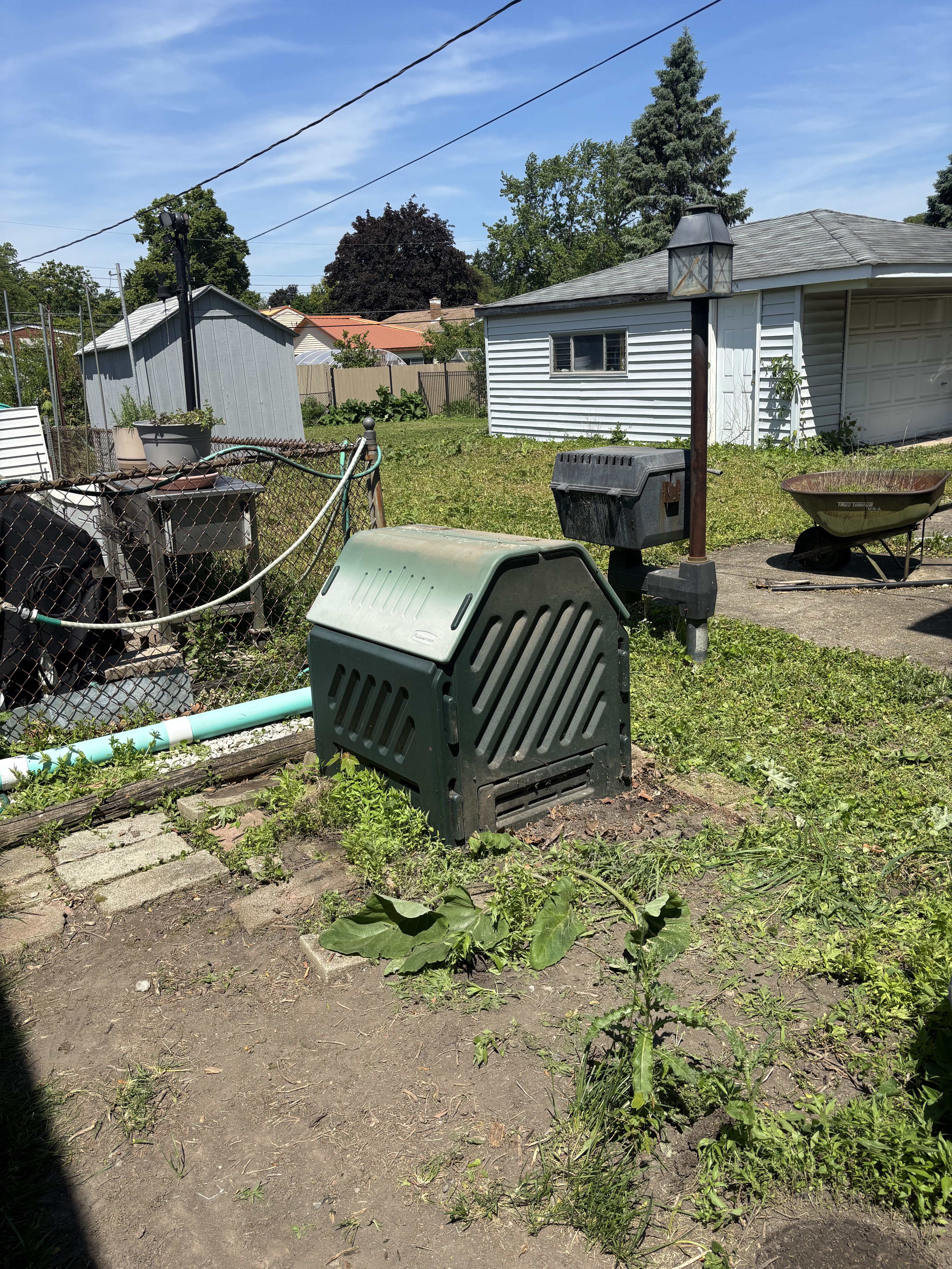 Yard junk items staged at curb for pickup